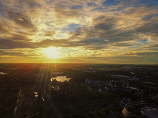 Beautiful sunset sky above the city with sky blue and orange light of the sun through the clouds in the sky, Orange and red dramatic colors, Warm color - Image