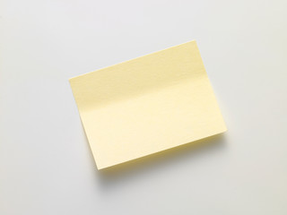 yellow sticky note on white background