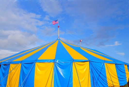 large blue and yellow stripe events or circus tent