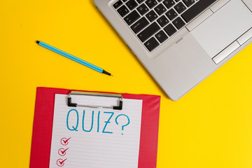 Writing note showing Quiz Question. Business concept for test of knowledge as competition between individuals or teams Trendy metallic laptop clipboard paper sheet marker colored background