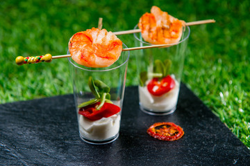 Fried Shrimp On A Skewer With Chili And Mayonnaise In Small Vodka Glass