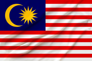 beautiful photo of the national flag of Malaysia on delicate shiny silk with soft draperies, the concept of state power, country life, horizontal, close-up, copy space