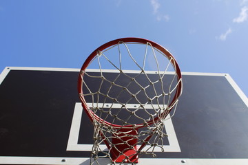 basketball hoop on background of blue sky