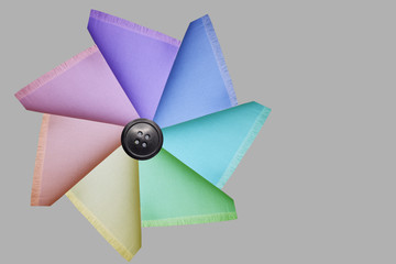 delicate silky cotton fabric folded in triangles of different colors, texture, background, blank for postcard, copy space