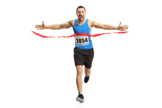 Happy Young Man Finishing A Marathon Race On The Finish Line