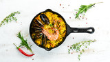 Seafood rice. Paella with mussels and shrimp. Top view. Free space for your text.