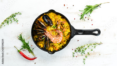 Seafood rice. Paella with mussels and shrimp. Top view. Free space for your text.
