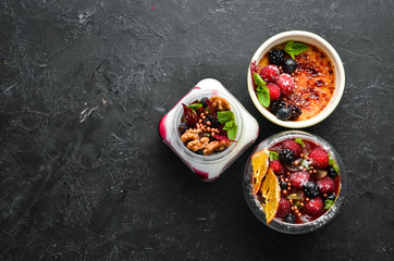 Dessert with fruits, berries and nuts. Top view. Free space for your text.