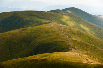 Landscape of hills covered with green grass. Location place Ukraine Carpathian mountains, Borzhava ridge.
