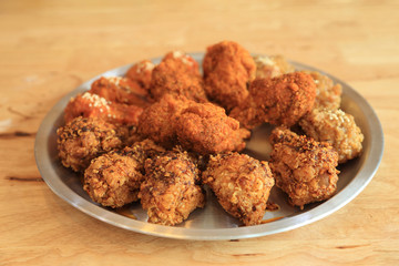 Crisp deep fried chicken with several kind of spicy sauce.