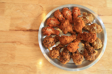 Crisp deep fried chicken with several kind of spicy sauce.