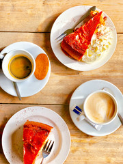 A amazing coffee break table with apple cake, chantilly  and cappuccino . 