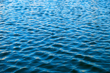 Empty water surface with blue ripples.