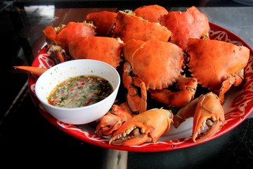 Boiled crab fresh with seafood spicy sauce Thai seafood, Crab showing crab's eggs inside shell.