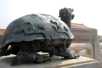 Forbidden City, Beijing, China. Bronze statue of a turtle inside the Forbidden City. The Forbidden City has traditional Chinese architecture. The Forbidden City is also the Palace Museum, Beijing. - obrazy, fototapety, plakaty