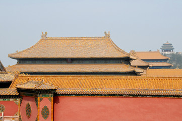 Forbidden City, Beijing, China. Red walls and yellow roofs of the Forbidden City. The Forbidden City has traditional Chinese architecture. The Forbidden City is also the Palace Museum, Beijing, China.