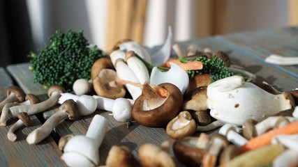 fresh mushrooms on a wooden surface