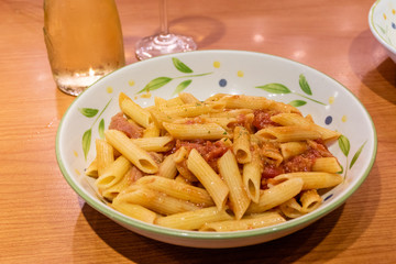 Pasta alfredo penne with tomato based sauce