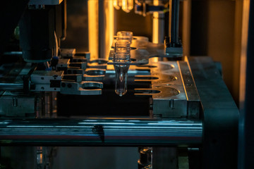 The operation of PET bottle processing by blowing process with the blowing mould. The  plastic...