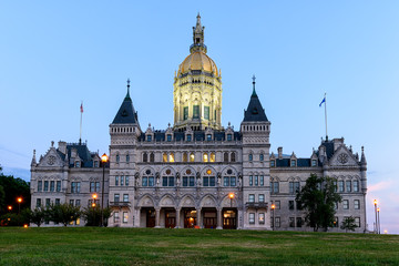 Naklejka premium Connecticut State Capitol Building with lights turned on after sunset