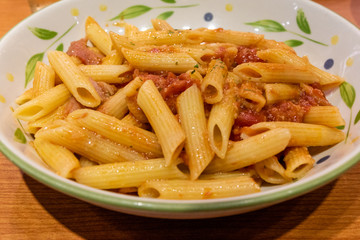 Pasta alfredo penne with tomato based sauce