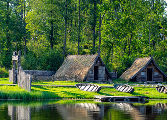 ancient fishing village by the lake with boats