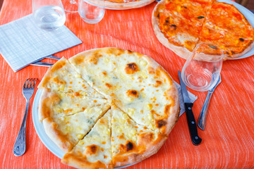 Pizza with mozzarella cheese, olive, fresh tomato and parma.