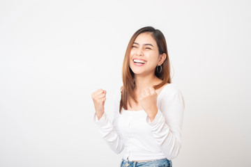 Beautiful happy woman is celebrating in studio white background