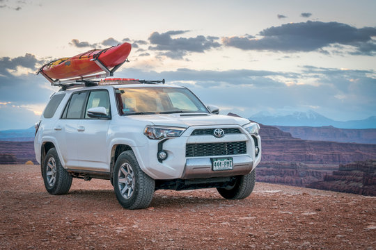 Toyota 4runner SUV with a kayak on roof on a canyon trail Stock Photo Adobe Stock