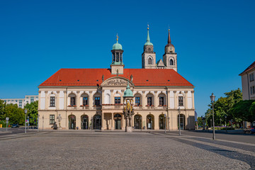 Fototapeta na wymiar Panoramic view at City Hall (Rathaus), Golden Equestrian statue of Magdeburger Reiter and Alter Markt Square in Magdeburg at blue sky and sunny day, Germany