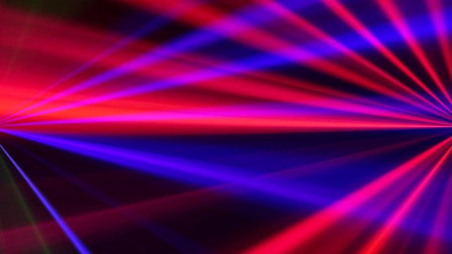 Beams motion. Disco party. Neon pink blue defocused rays.