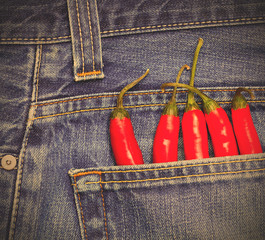 red peppers in a jeans pocket