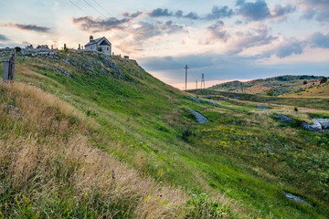 Fototapeta na wymiar Ancient stone church on the top of the hill