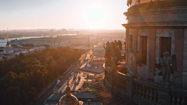 Sunny drone views of sculptures of angels on the colonnade of St. Isaac's Cathedral in Saint Petersburg, Russia