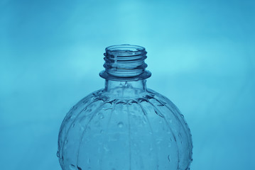  open plastic bottle on light background close up           