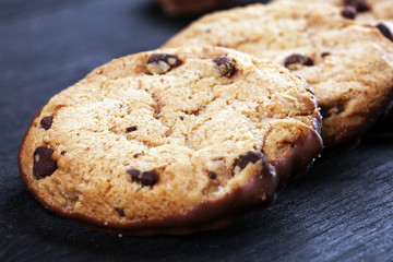 Chocolate cookies on wooden table. Chocolate chip cookies shot on table