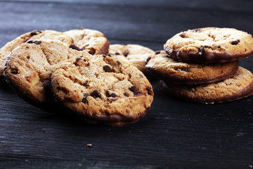 Chocolate cookies on wooden table. Chocolate chip cookies shot on table