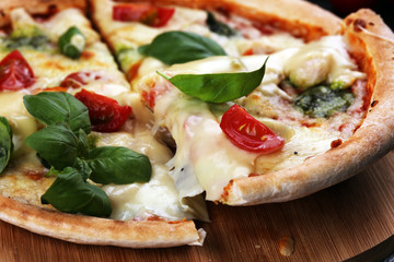 vegetarian italian Pizza with tomatoes, mozzarella cheese  and basil. Delicious italian pizza