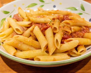 Pasta alfredo penne with tomato based sauce