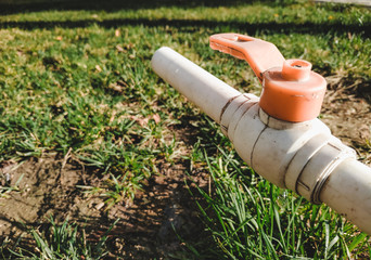 Watering tap in garden close up macro photo