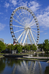 MONTREAL, CANADA June 25, 2018: La Grande Roue de Montreal is the tallest Ferris wheel in Canada. The Big Ferris Wheel in Old Harbour.