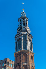 Fototapeta na wymiar Amsterdam, North Holland / Netherlands - June 22nd, 2019: The Munttoren bell tower / Close-up