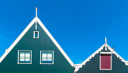 Volendam, North Holland / Netherlands - June 23rd, 2019: Close-up of the roof of two wooden green houses in the waterfront