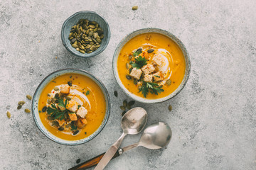 Two Bowls of delicious autumn pumpkin soup