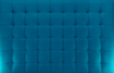 Pattern of a blue cloth upholstered headboard