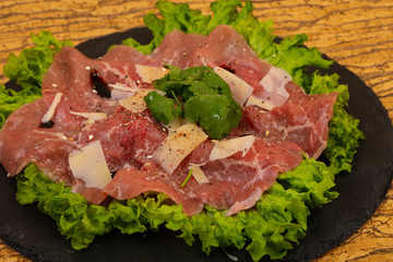 Beef carpaccio with parmesan cheese