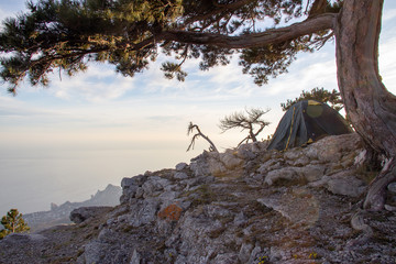 Tent in the evening sun in the mountains