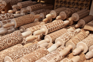 Wooden shafts for rolling pasta dough or cookies in the carved patterns