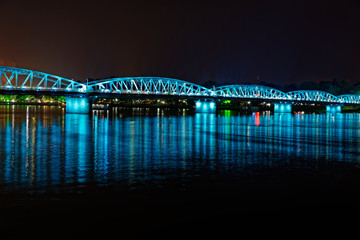 Fototapeta premium Night scene of a bridge in blue lights. Hue, Vietnam