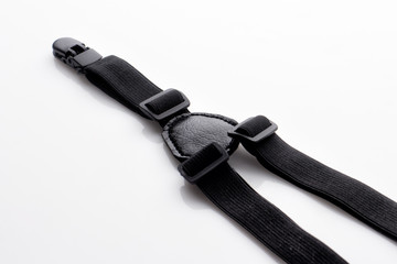 Black suspender isolated on white. Trendy menswear suspenders accessory for your design, online store and mock-up. 